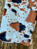 Adult Black and Tan Cowhide Minky on Minky Blanket